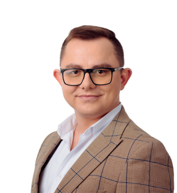 Zdjęcie portretowe trenera szkolenia, Dawida Rachmajdy.