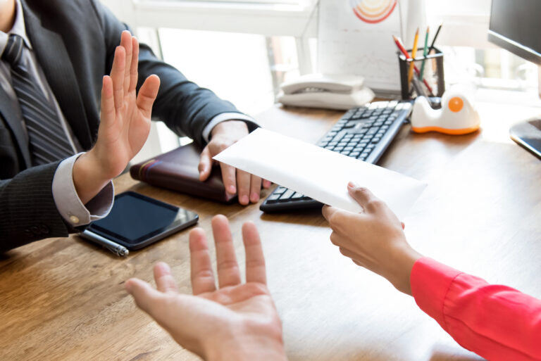 man refusing the envelope